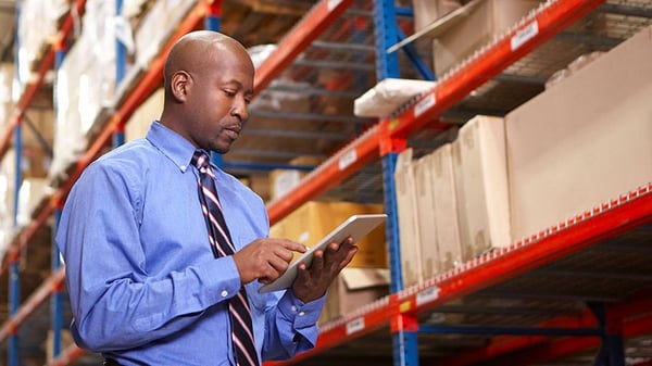 man-in-warehouse-910x512